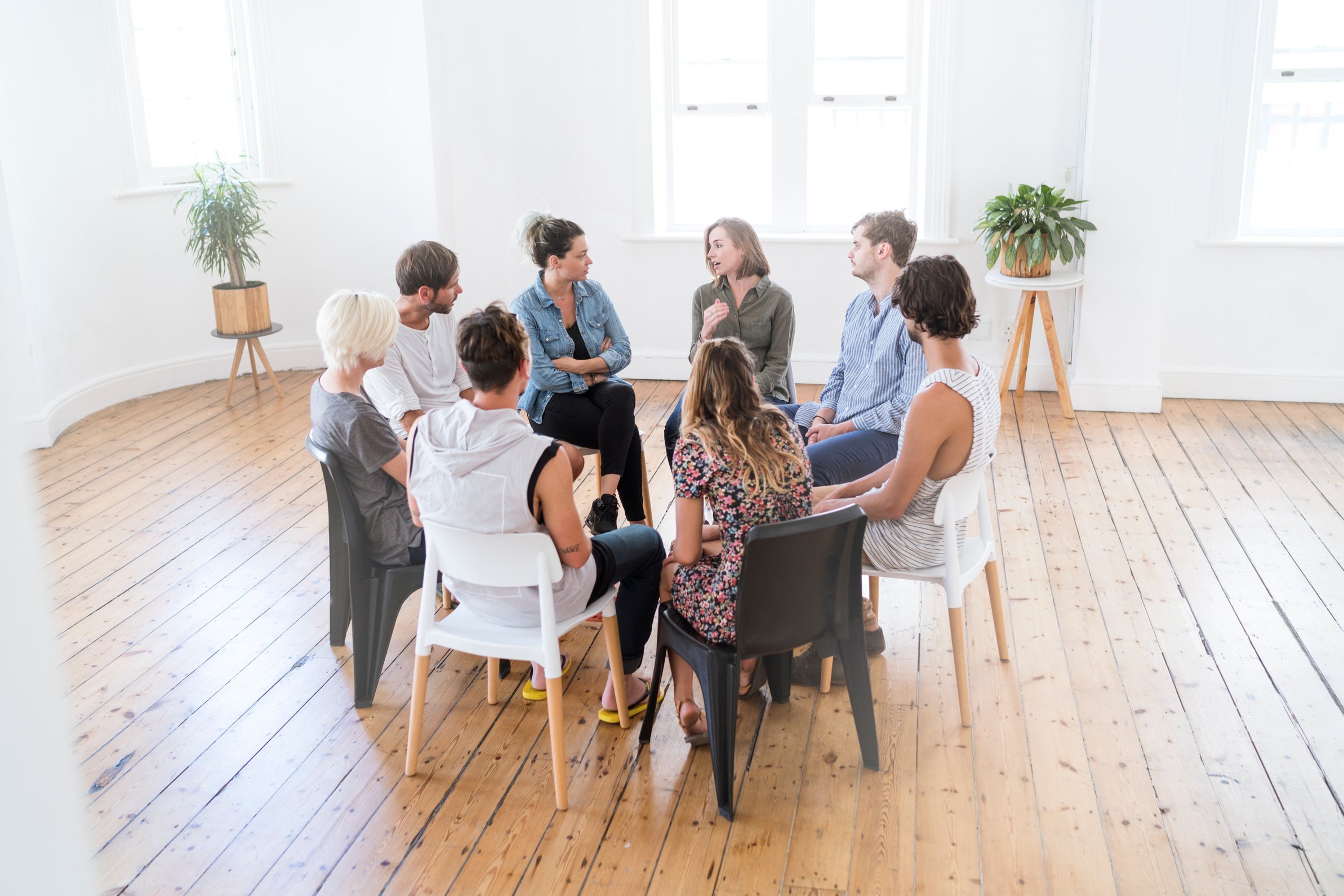 Woman speaking in group therapy session